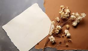 Brown Piece Of Paper And Dried Flowers