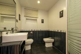 Bathroom With Wood Framed Black Mirror