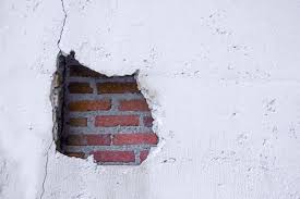 Hole In Broken Wall And Old Bricks