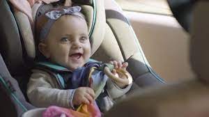 Cute Baby Girl Plays With Toy In Car