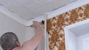 Male Removing Off Old Paper Wallpaper