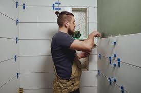Repairman Applying Tile Adhesive With A