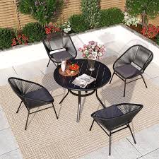 Round Metal Table And Wicker Chairs