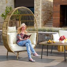 Yellow Wicker Pation Outdoor Swivel Egg Chair With Beige Cushion