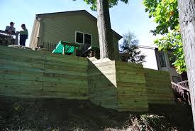 giant wood timber retaining wall built