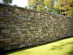 A Stone Wall Wall With Stones On It