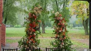 Wedding Arch With Flowers And Chairs