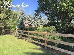 cedar post and rail fence with step by