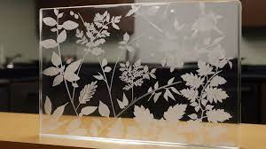 White Flower Pattern Is Placed In Glass