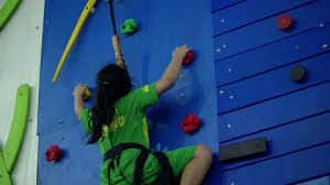 Child Is Training On The Climbing Wall