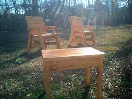 Outdoor Arm Chairs And A Side Table