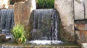 Water Fountain With Wet Rocks Stock