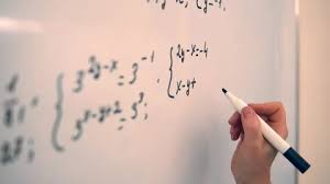 Girl Student Writing Math Equation On