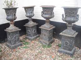 4 Matching Cast Iron Garden Urns On