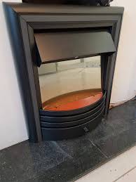 Electric Fireplace In A Real Fireplace