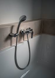 Handheld Shower Head To A Bathtub