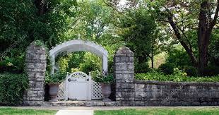 Stone Wall With Garden Gate Stock Photo