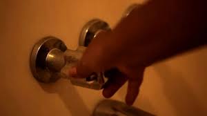 Black Woman Hand Turning Shower Knobs