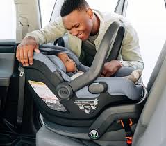 Uppa Baby Putting Baby In Mesa Car Seat