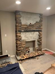 stone fireplace with barn wood mantel