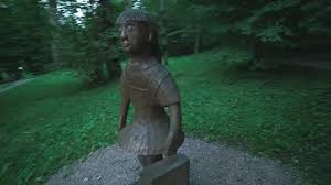 Funny Wooden Statue Of A Little Girl In