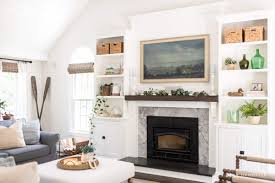 A Brick Fireplace With Wood Stone