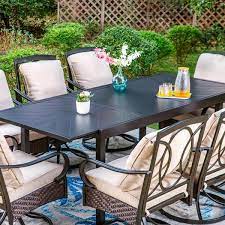 Phi Villa 9 Piece Metal Outdoor Dining Set With Rectangular Carve Pattern Table And Rattan Swive Chairs With Beige Cushions