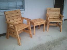 Outdoor Arm Chairs And A Side Table