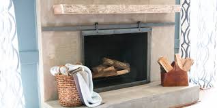 wood mantel on a masonry fireplace