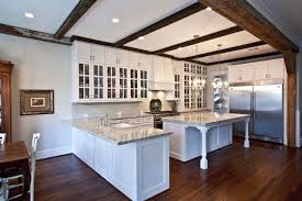 white kitchen with beamed ceiling