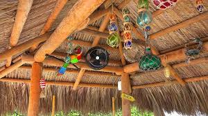 Colorful Outdoor Tiki Bar With Thatch Roof
