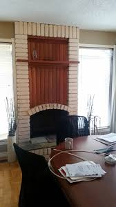 Brick Fireplace With Ugly Wood Paneling