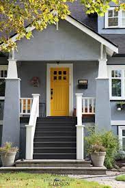 Bright Yellow Front Door With Gray Siding