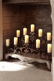 A Fireplace Mantle With Flameless Candles