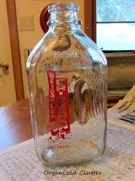 Vintage Glass Milk Bottles In A Wire