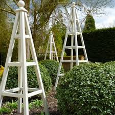 Wooden Garden Obelisks On A Little Bird