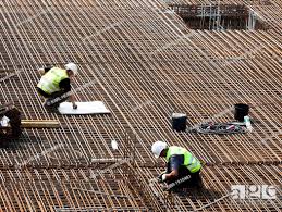 construction workers installing steel