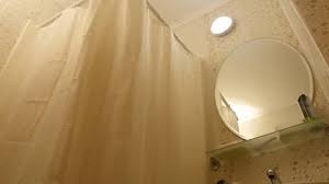 Person Takes A Shower In The Bathroom