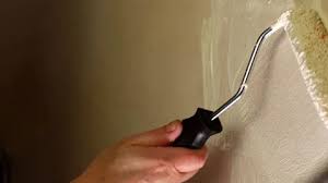 Painting A Home Wall With A Roller And
