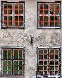 Four Front Windows On The Facade Of A