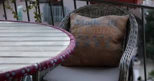 Furniture With Cross Stitch Pillow In
