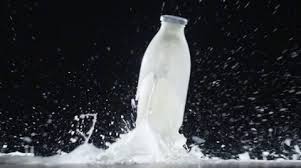 Glass Bottle Of Milk Falls And Breaks