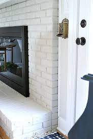 Limewashing A Painted Brick Fireplace