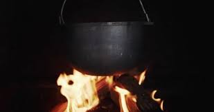Cast Iron Pot Hanging In A Wood Stove