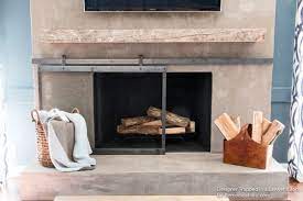 wood mantel on a masonry fireplace