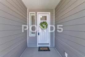 White Front Door With Lockbox Wreath