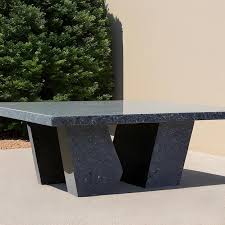 A Marble Table With A Square Base And