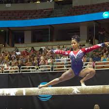 gymnast saves herself from falling off