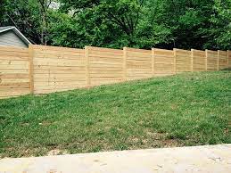 How A Wood Fence Is Installed On A