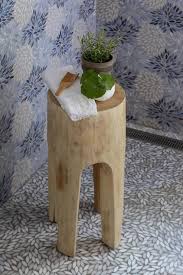 Small Teak Stool On Blue Mosaic Shower